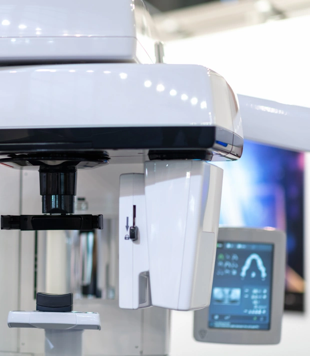 Close‑up of modern dental imaging machine and monitor showing digital dental scan technology