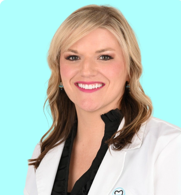 Dr. Maegan Elam, DDS, cosmetic and family dentist at Bedford, TX dental office smiling in professional portrait