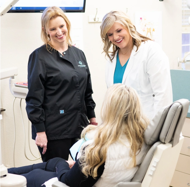 Dentist and dental assistant providing general dentistry care to patient at Bedford, TX dental office