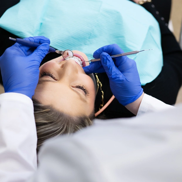 performing periodontal treatment to treat gum disease in Bedford, TX